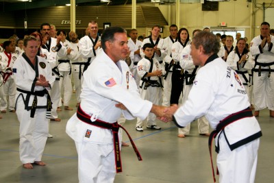 KJN St. James accepting 8th Dan from KJN Washington